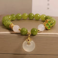 Women's green tourmaline bracelet with four-leaf clover charm and safety buckle in new Chinese style