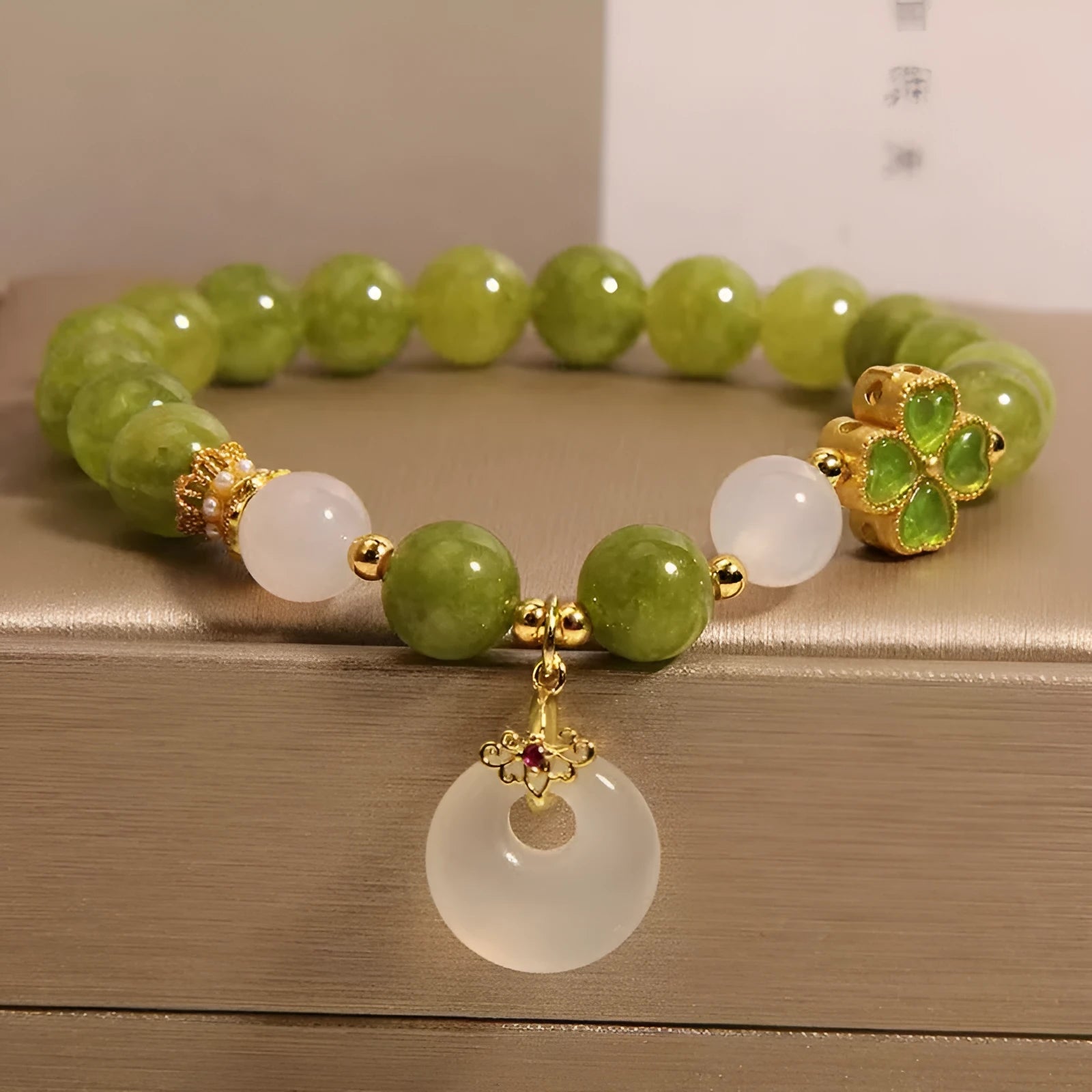 Women's green tourmaline bracelet with four-leaf clover charm and safety buckle in new Chinese style