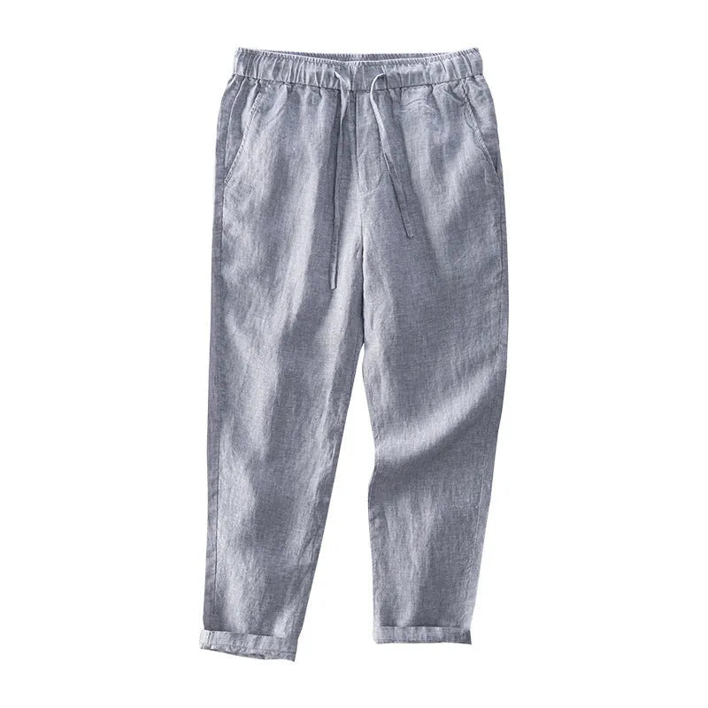Men's straight-leg linen trousers in a mid waist cut, shown in a neutral colour.