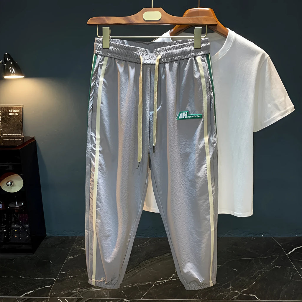 Men's black cotton harem pants with mid-waist design and relaxed leg fit