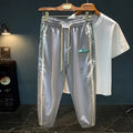 Men's black cotton harem pants with mid-waist design and relaxed leg fit