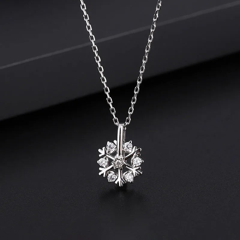 Pure silver rotating snowflake necklace with electroplated finish on adjustable cross chain for women