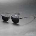 Polarized sunglasses with pure titanium frame in box style, gun mount colour with black and gray lenses