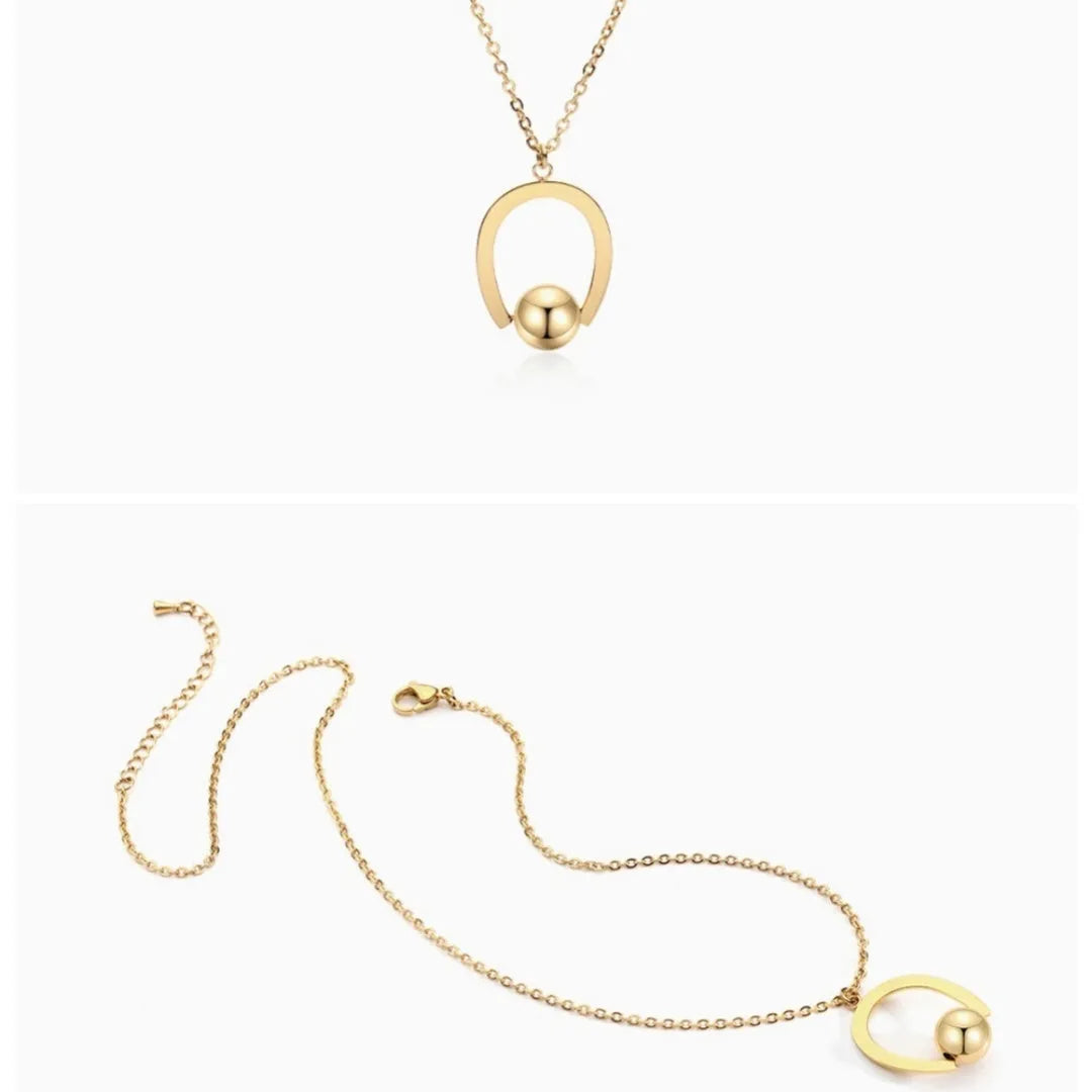 Gold and silver stainless steel necklace with geometric pendant on a cross chain, adjustable length.