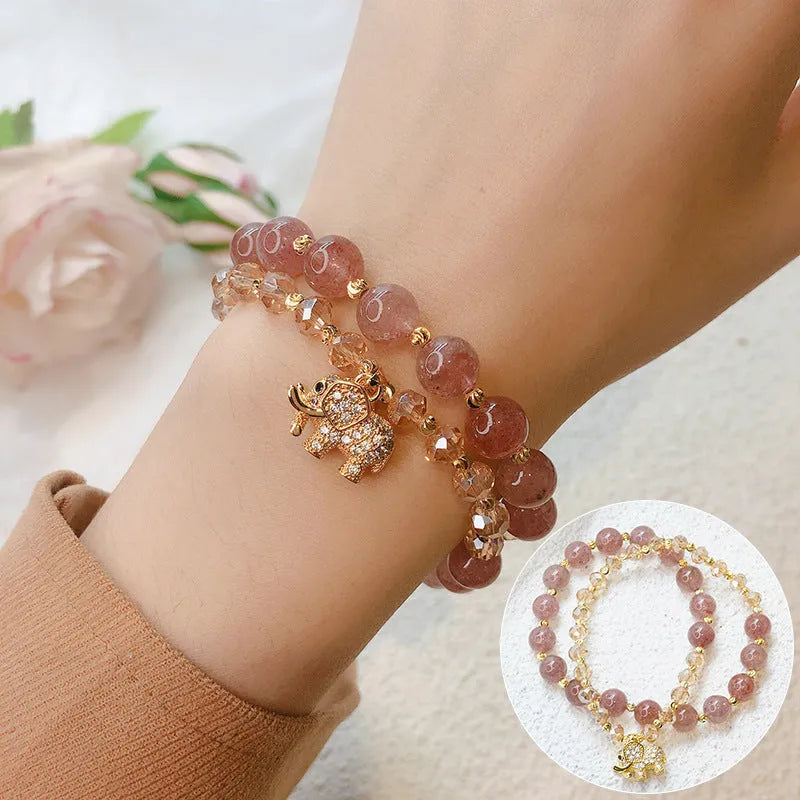 Retro style women's bracelet with colour hair crystal or strawberry quartz beads on a wrist.