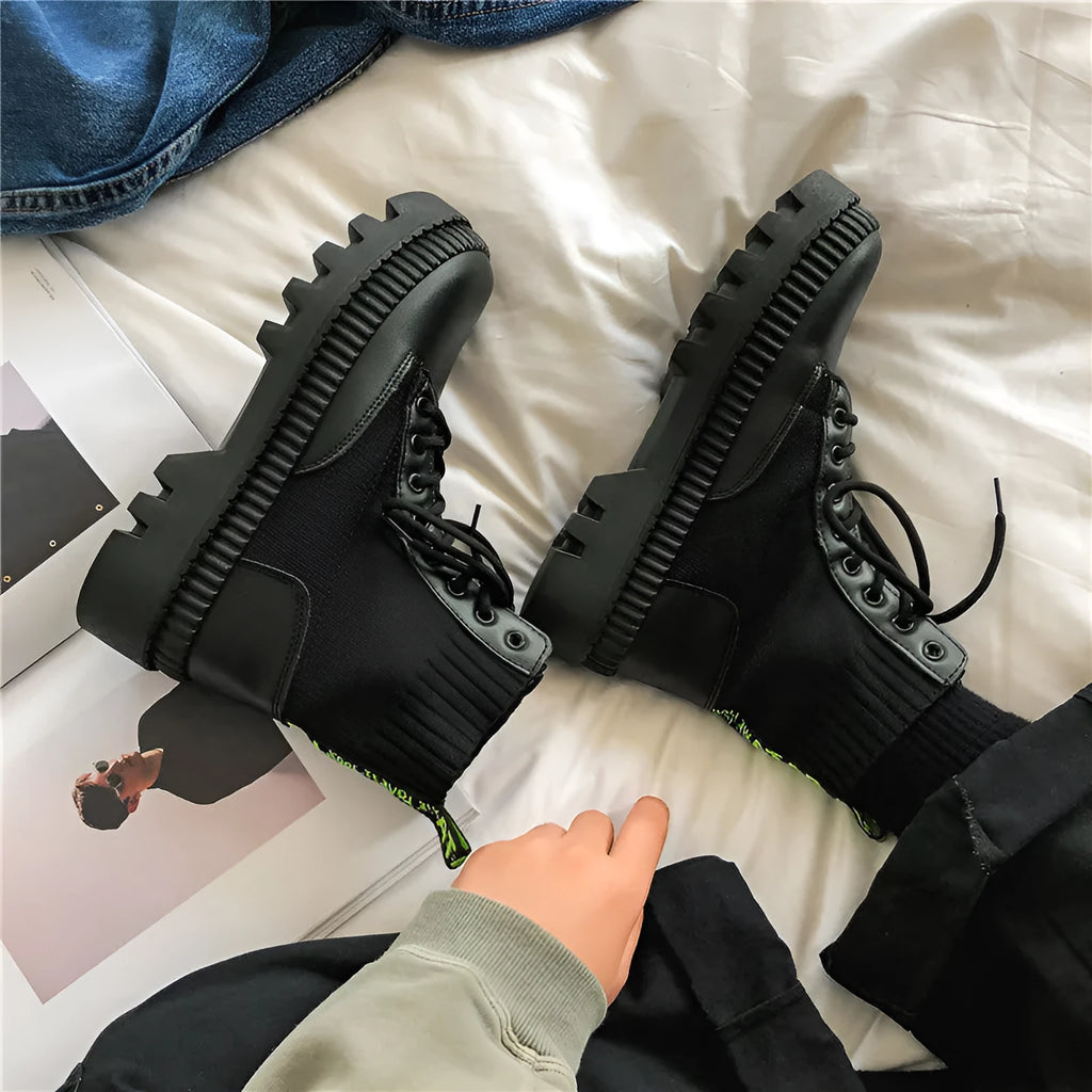 Men's black platform Doc Martens boots with side zipper and 8-hole high-top design.