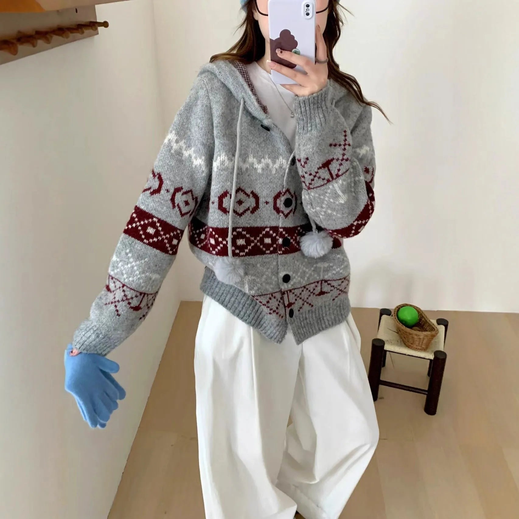 Plus size women's grey geometric pattern brocade knit sweater coat with long sleeves.
