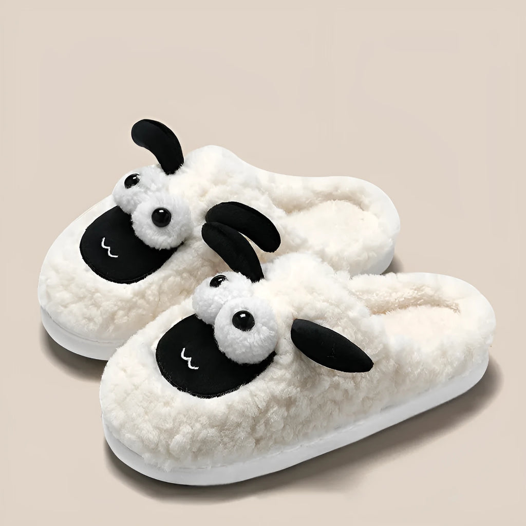 Brown lamb thermal cotton slip-on slippers with a stitched PVC sole on a wooden floor.