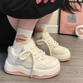 Women's green patent leather platform sneakers with round toe and lace-up closure