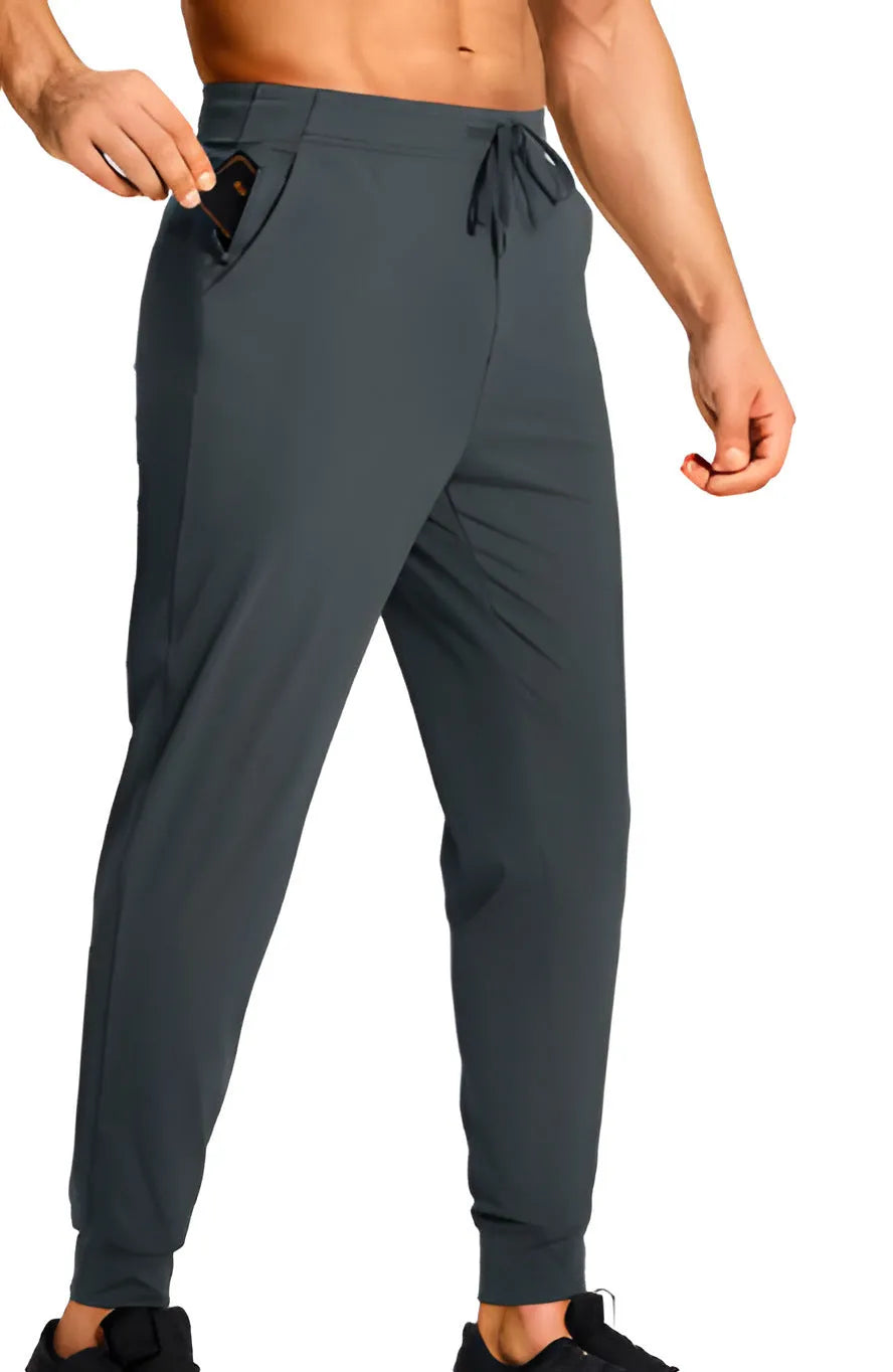 Men's loose fit solid colour casual trousers in polyester fabric on a hanger