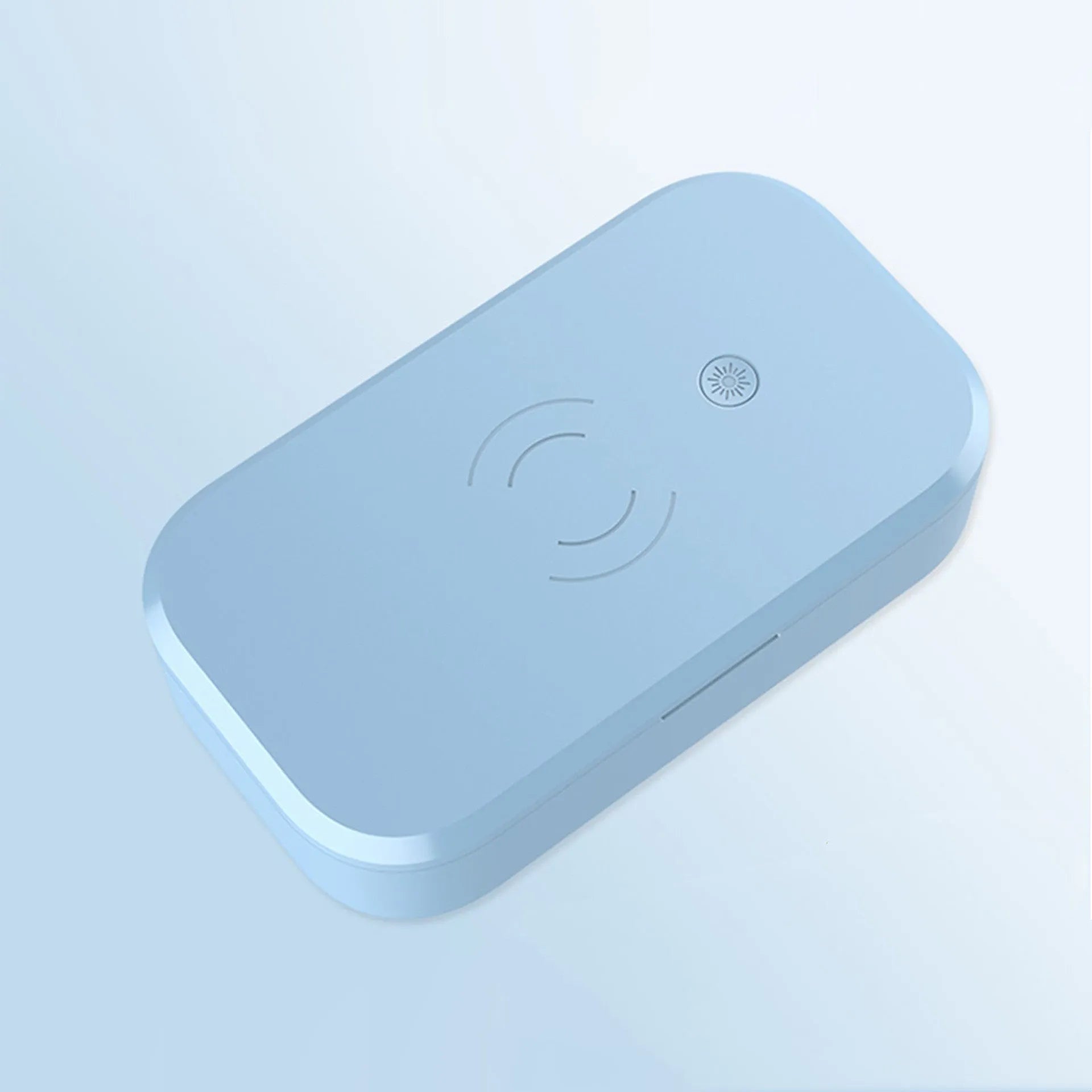 White multifunctional UV disinfection box with wireless charging pad for mobile phones and nail tools.