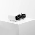 White wireless charging pad with Bluetooth speaker and night light functions