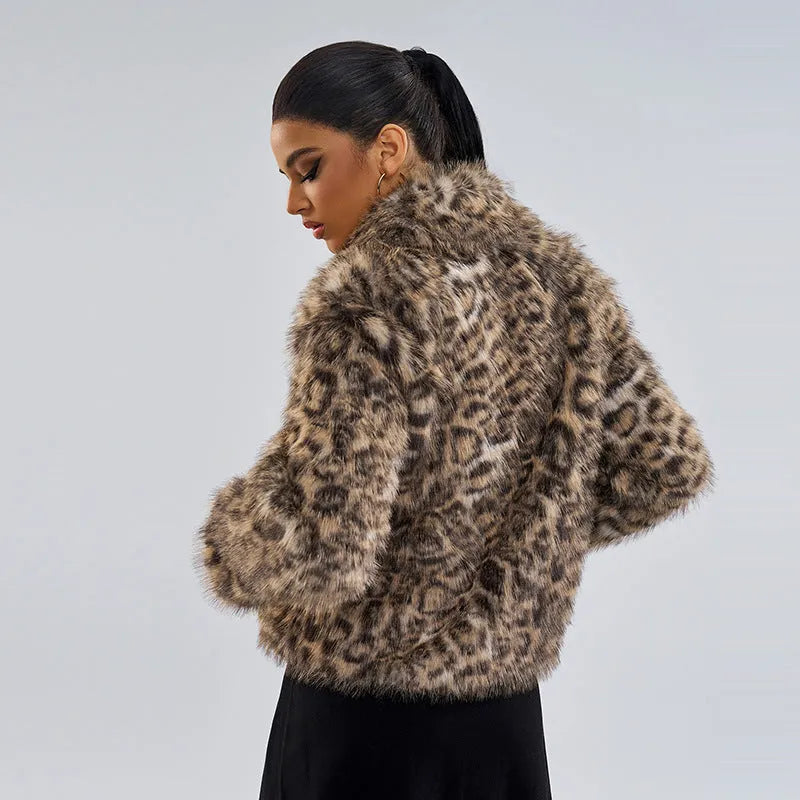 Women's leopard print polyester coat with a buckle lapel closure on a hanger
