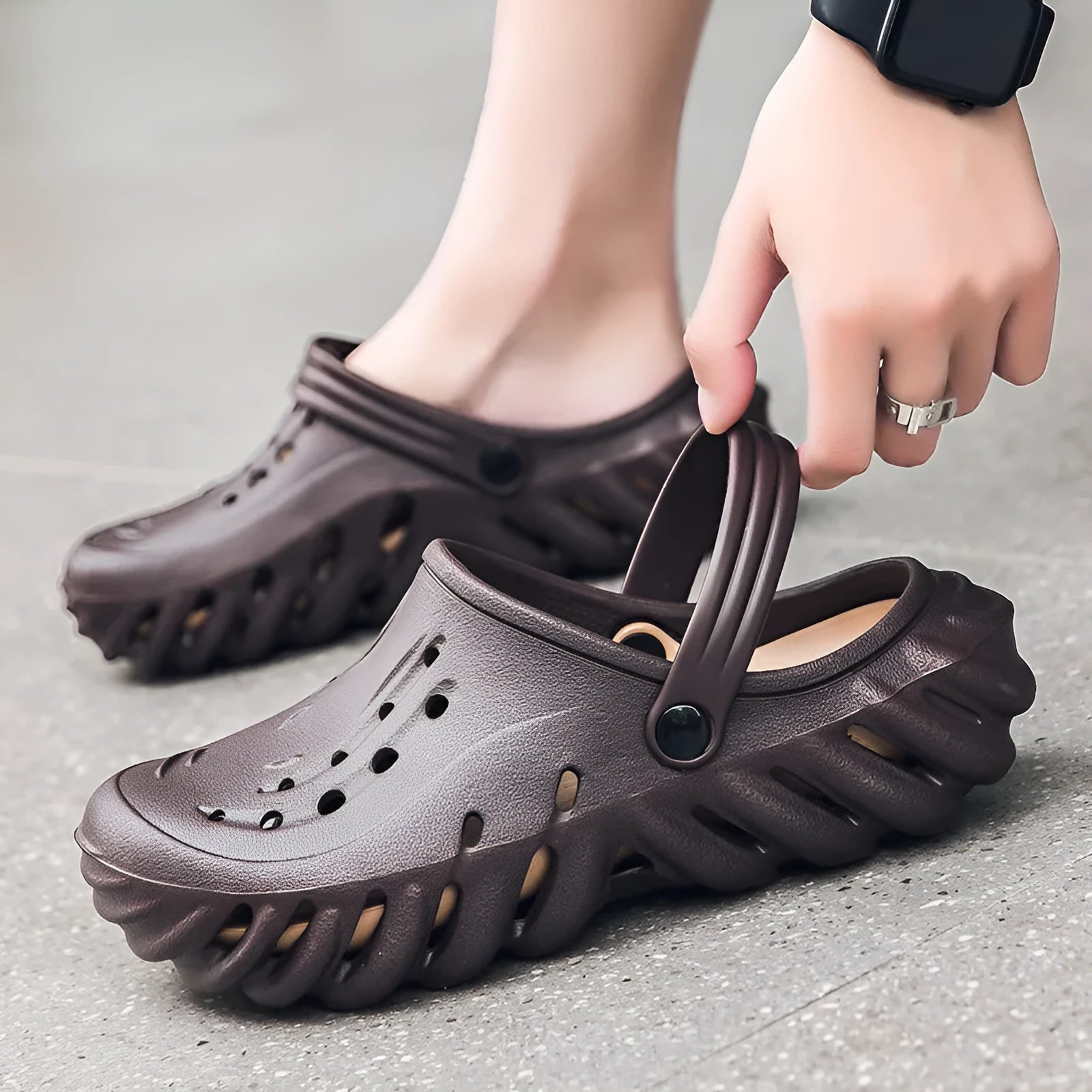Men's beige EVA hole shoes sandals with hollow out design and round toe on a non-slip sole.