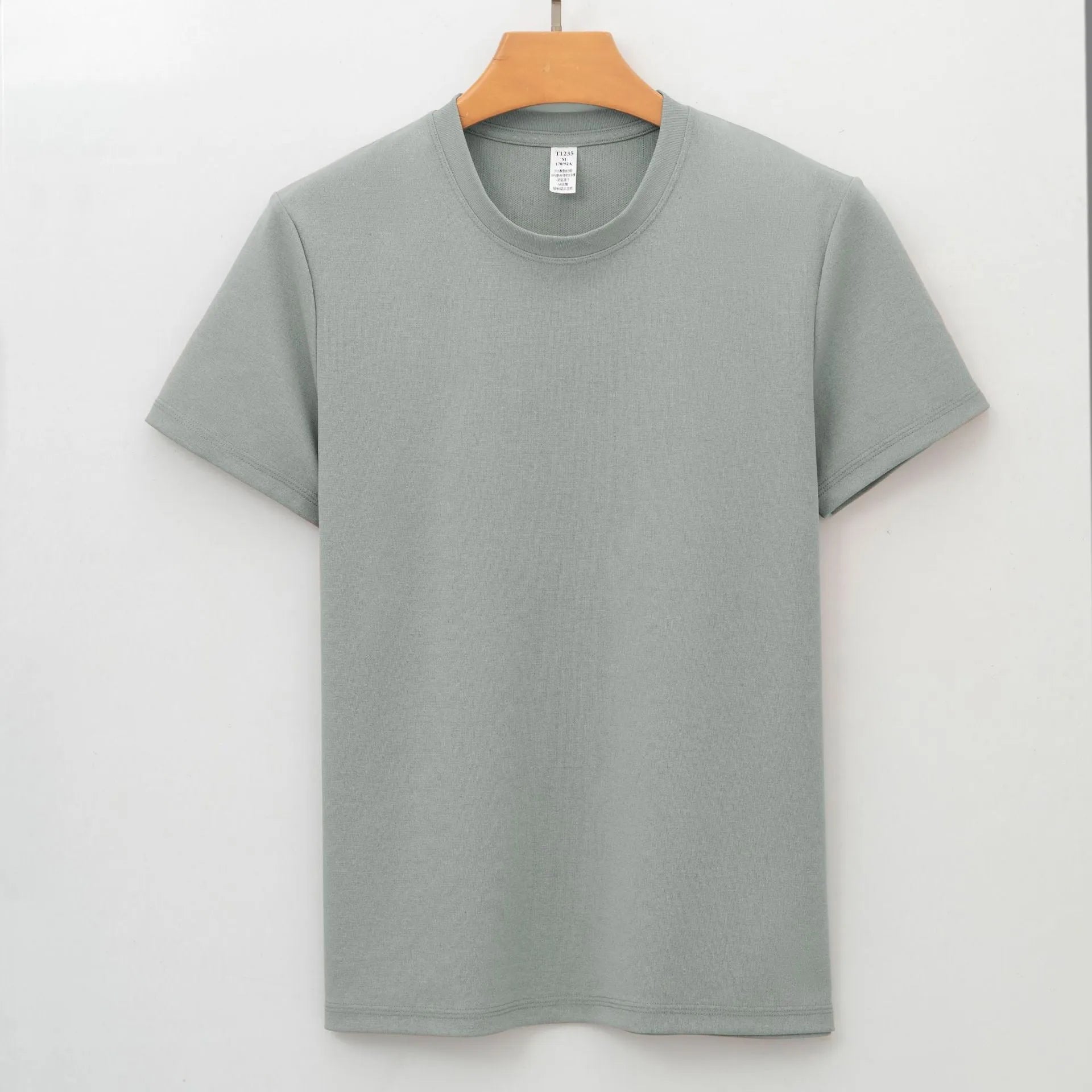 Men's solid colour antibacterial quick-dry short sleeve t-shirt on a hanger, straight cut style.