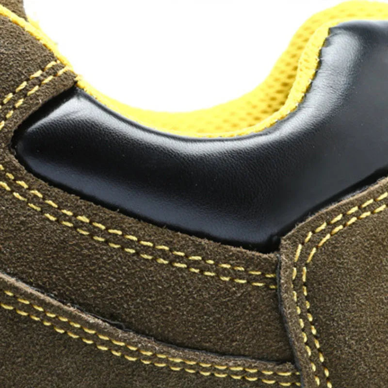Bronze coloured low-cut leather safety boots with a steel toe cap and textured anti-skid sole.