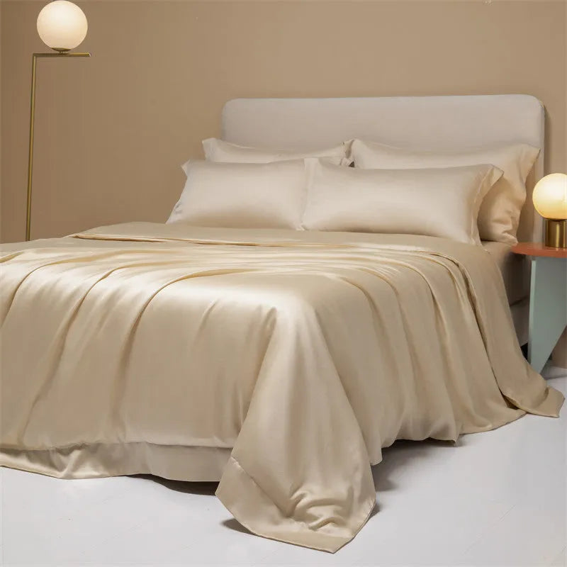 A modern, neatly made bed with a Lenzing Tencel duvet cover and pillowcases in a choice of nine colours like Sea Salt Blue.
