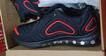Men's black air cushion running sneakers with white accents and a thick sole on a white background.