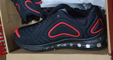 Men's black air cushion running sneakers with white accents and a thick sole on a white background.