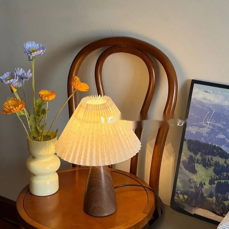 Nordic retro ceramic table lamp with pleated shade and remote control on bedside table