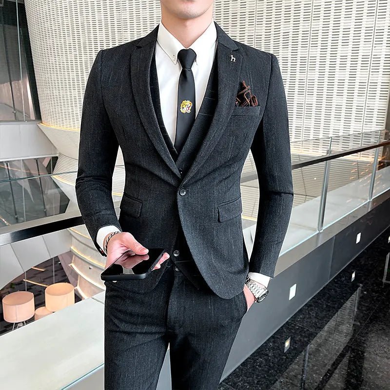 Slim fit men's business suit in British style cut, available in black or dark grey cotton blend fabric