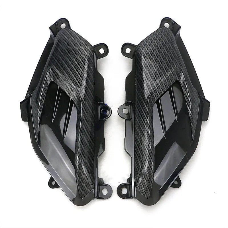 Pair of black LED side lamps for Yamaha NMAX scooter with carbon fibre decoration and clear lens.