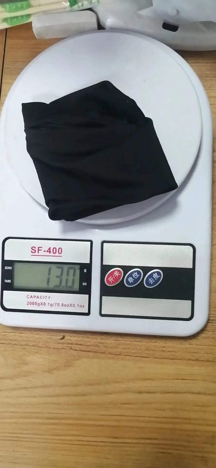 Black wrist bag armband sleeve with strap, showing 10cm by 10.5cm front pocket for a mobile phone.