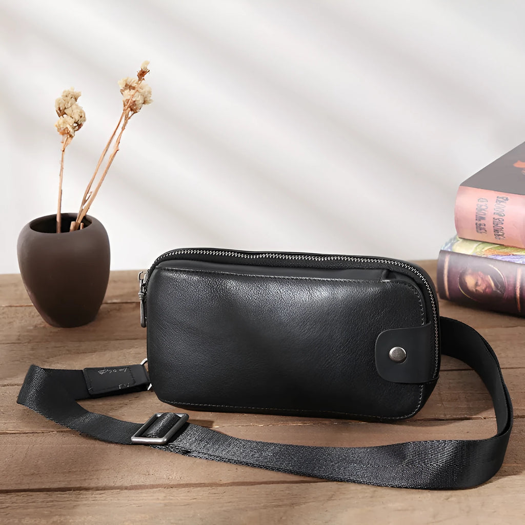 Men's small phantom black cowhide crossbody bag with pillow shape and zipper pockets