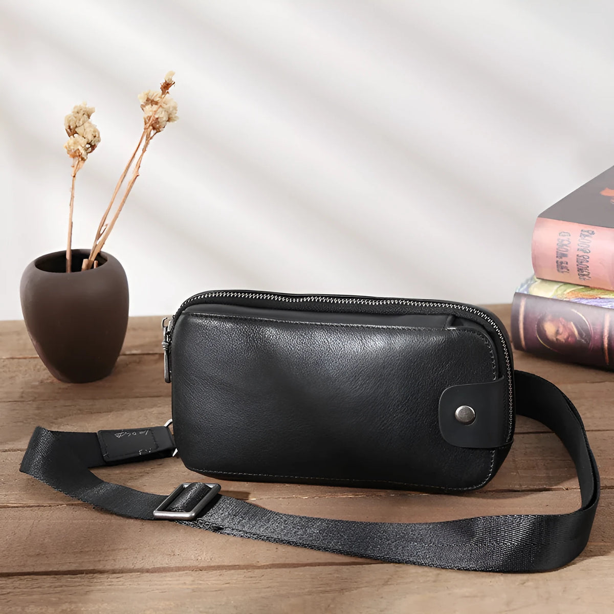 Men's small phantom black cowhide crossbody bag with pillow shape and zipper pockets