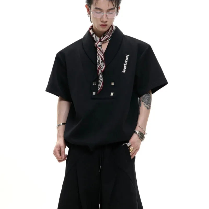 Men's dark grey V-neck cotton sports suit jacket with padded shoulders and matching shorts.