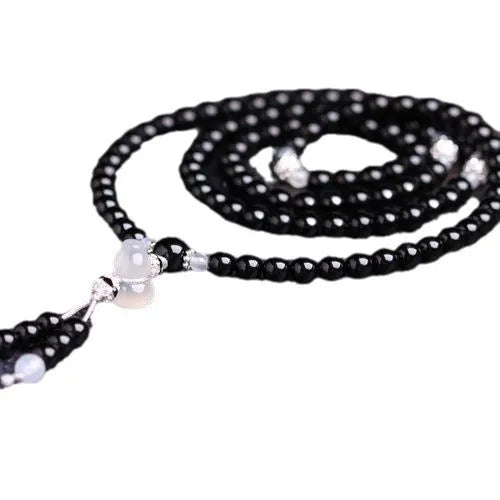 Natural black and red agate 108-bead bracelet with geometric shapes
