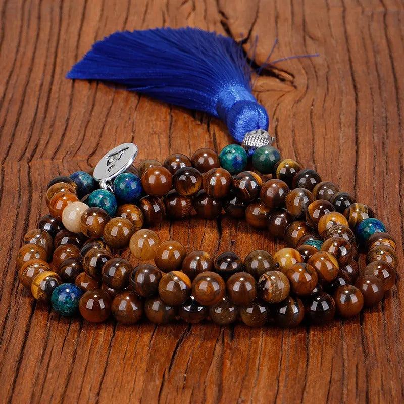 Handmade tiger eye stone bead necklace with Buddha head design, tassel pendant, geometric shape, and 81cm length.