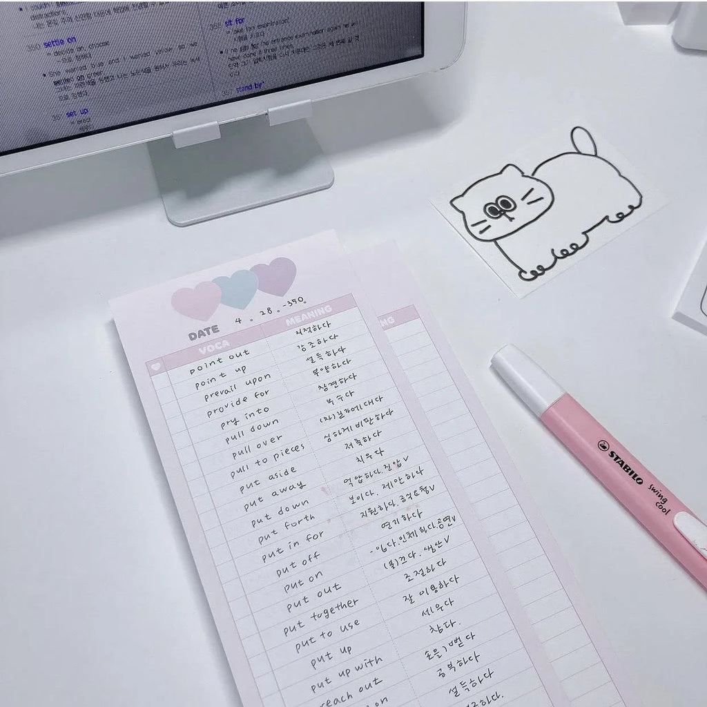 Half-B5 size vertical notepad with coloured cover, shown open to show lined pages.