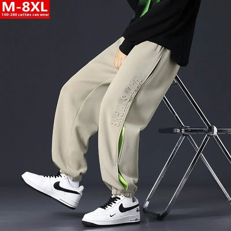 Men's loose-fit cotton trousers with ankle banded design in grey green colour