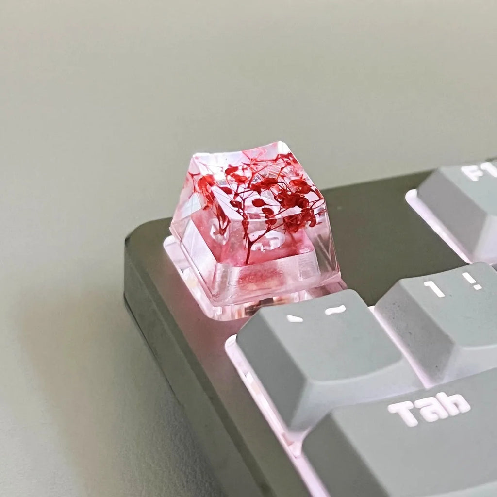 Transparent resin starry sky keycap with glitter particles in red, pink, green, violet colours for mechanical keyboards