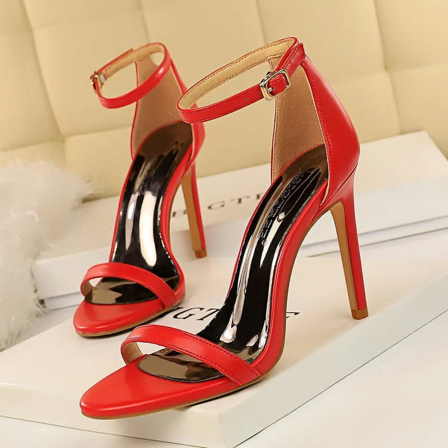 Women's open-toe high heel sandals with an ankle-strap and buckle in six colour options.