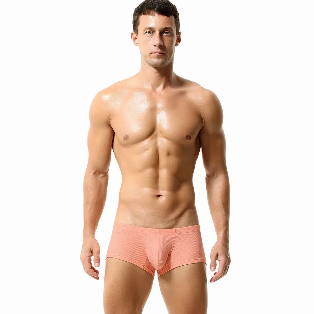 Men's solid colour boxer briefs with mid-low waist design in breathable nylon fabric
