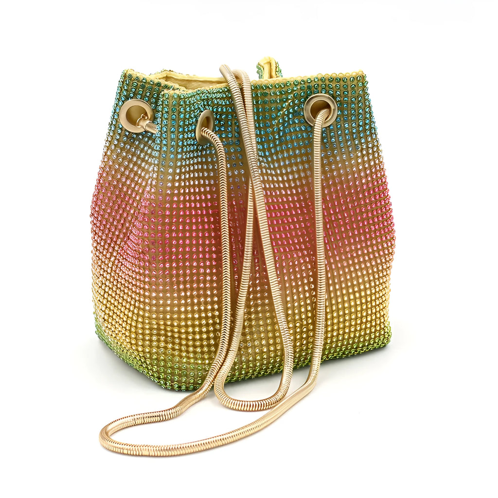 Soft rainbow rhinestone bucket bag with adjustable metal chain strap on a 28cm circular base.