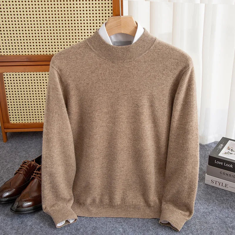 Man wearing a chunky knit half-turtleneck wool sweater in a loose fit.