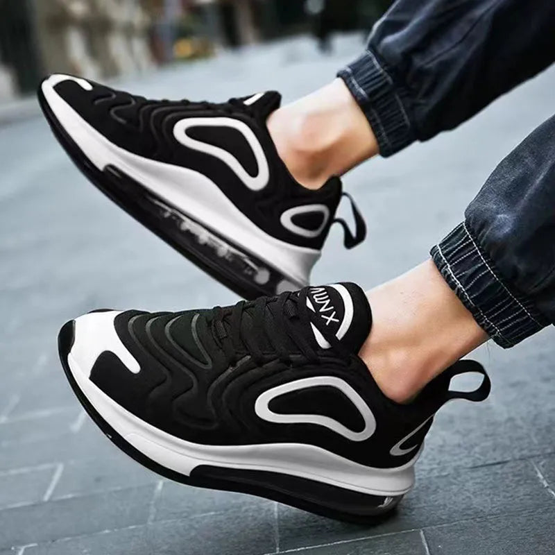 Men's black air cushion running sneakers with white accents and a thick sole on a white background.