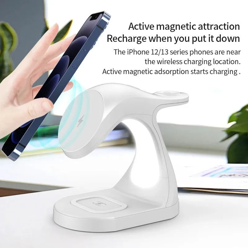 Fast Four In One Magnetic Wireless Fast Charger in black with phone, earphones, and watch placed on charging areas