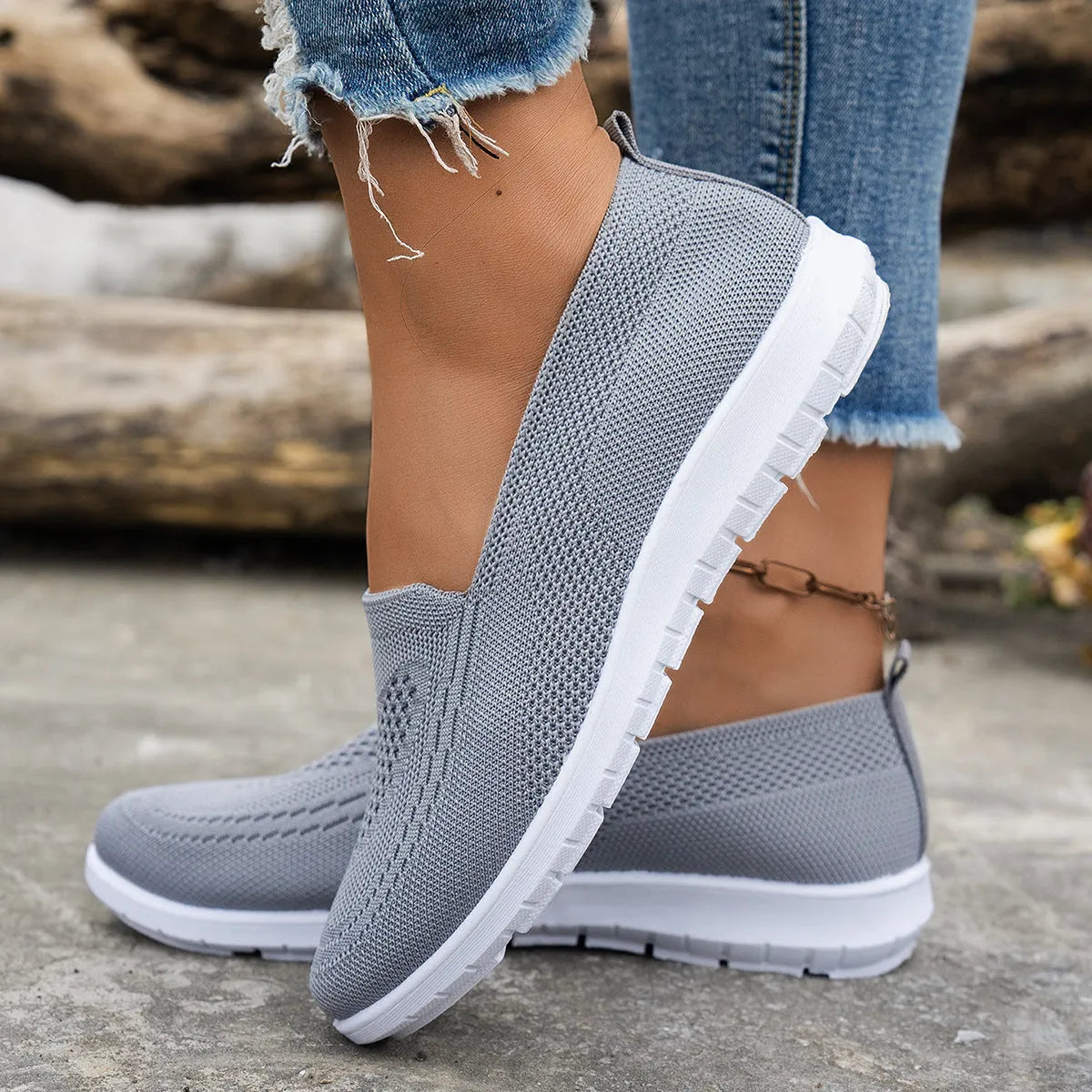 Women's mesh trainers with low flat heel and PVC sole, shown in a solid colour casual style