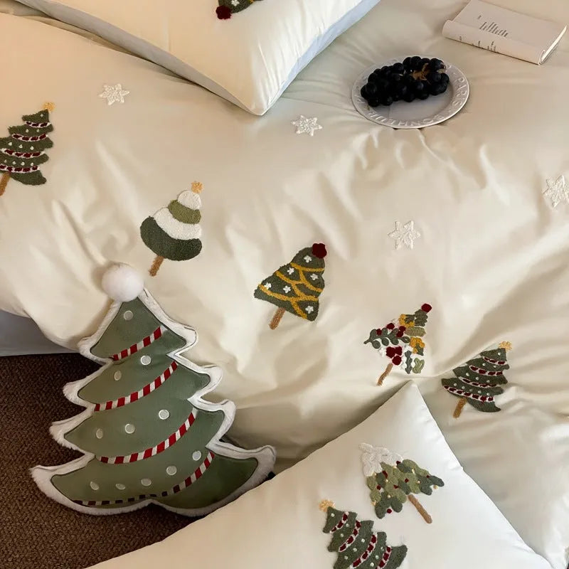 Cream blue duvet cover with embroidered Christmas tree and towel motif, part of a 100% cotton four-piece bedding set.
