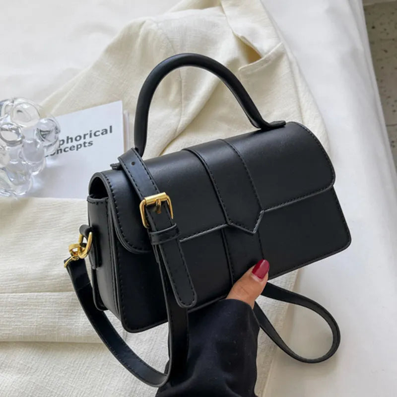 Beige women's horizontal square messenger bag with sandwich pocket and file organiser interior.