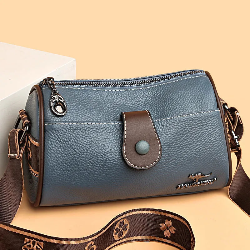 Women's top grain leather crossbody bag in blue, black, or khaki with horizontal square shape and inner pockets.