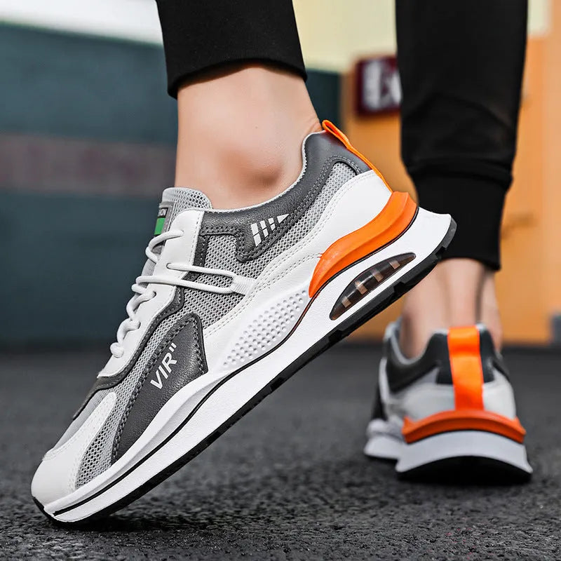 Men's grey breathable mesh running shoes with a round toe and EVA sole on a white background