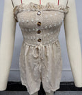 Blue off-shoulder sleeveless jumpsuit for women with a mid waist and button detail.