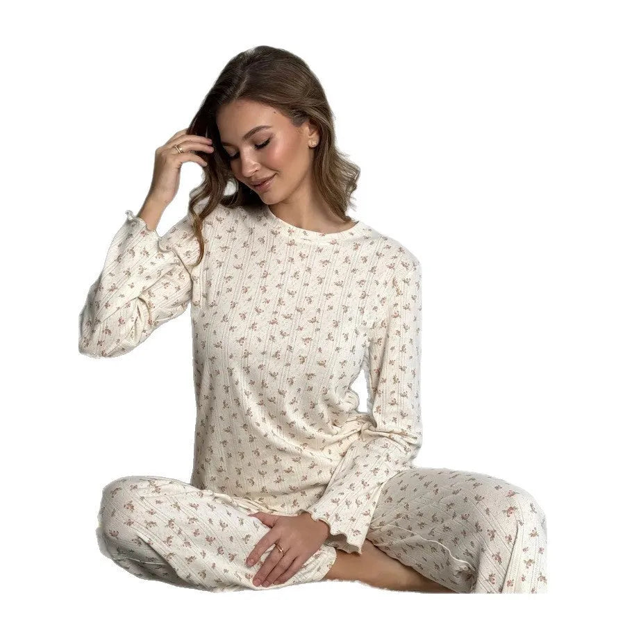 Women's white floral print bell sleeve top and wide-leg trousers loungewear set on a hanger.