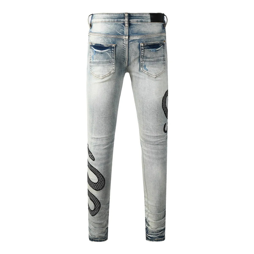 Man wearing 8934Blue distressed skinny jeans with a retro wash and skinny leg fit.