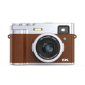 Black 5K digital camera with front and rear lenses, optical viewfinder, and a 2.88-inch display screen on the back.